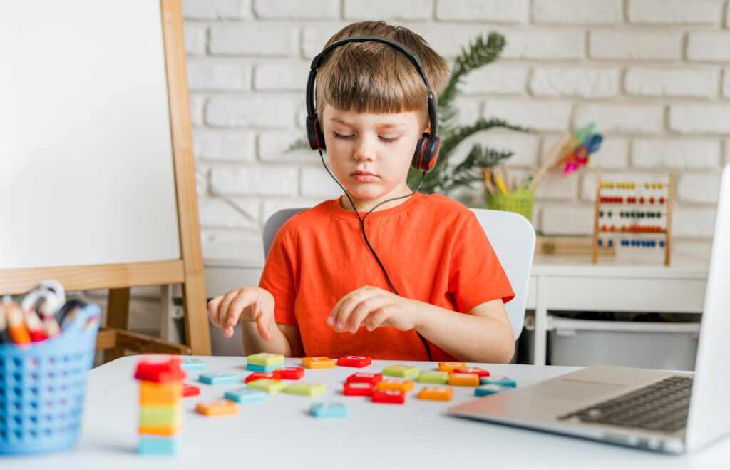 Medium shot kid with laptop